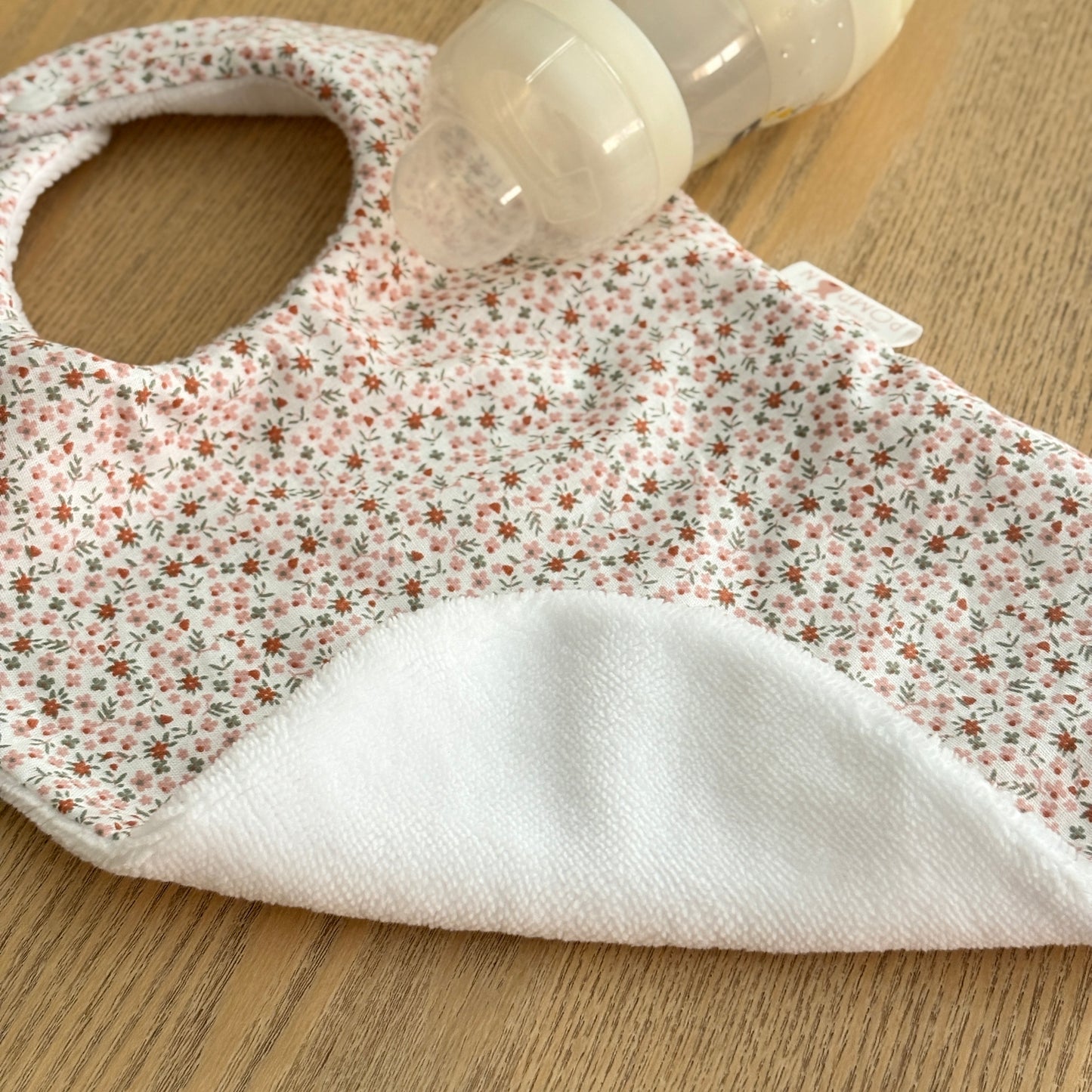 Bavoir bébé fleurs rose